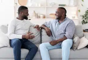 Two black men talking to each other