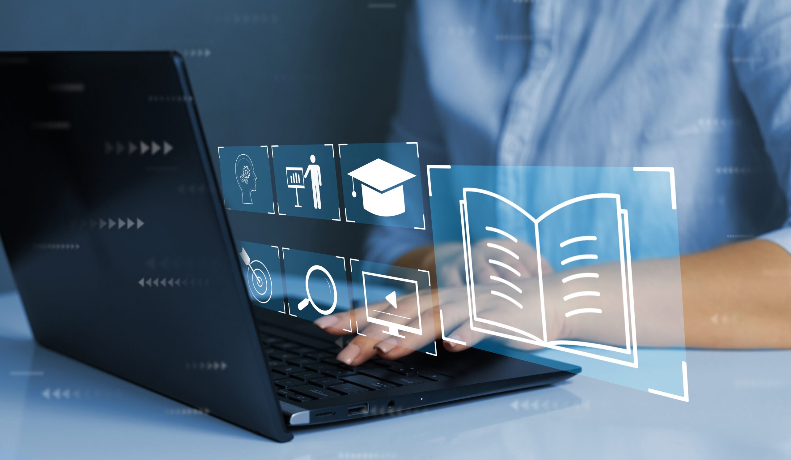 Person typing on computer with icons visible